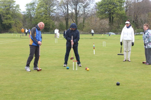 Visitors trying out croquet
